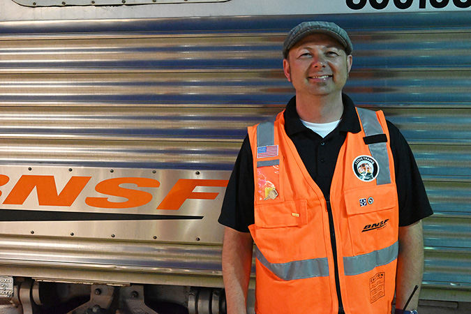 Ed Tumbas stands outside of one of BNSF’s business cars on the 2023 Employee Appreciation Special trip.